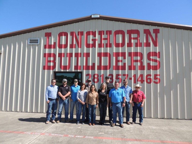 Longhorn Builders team outside a commercial building