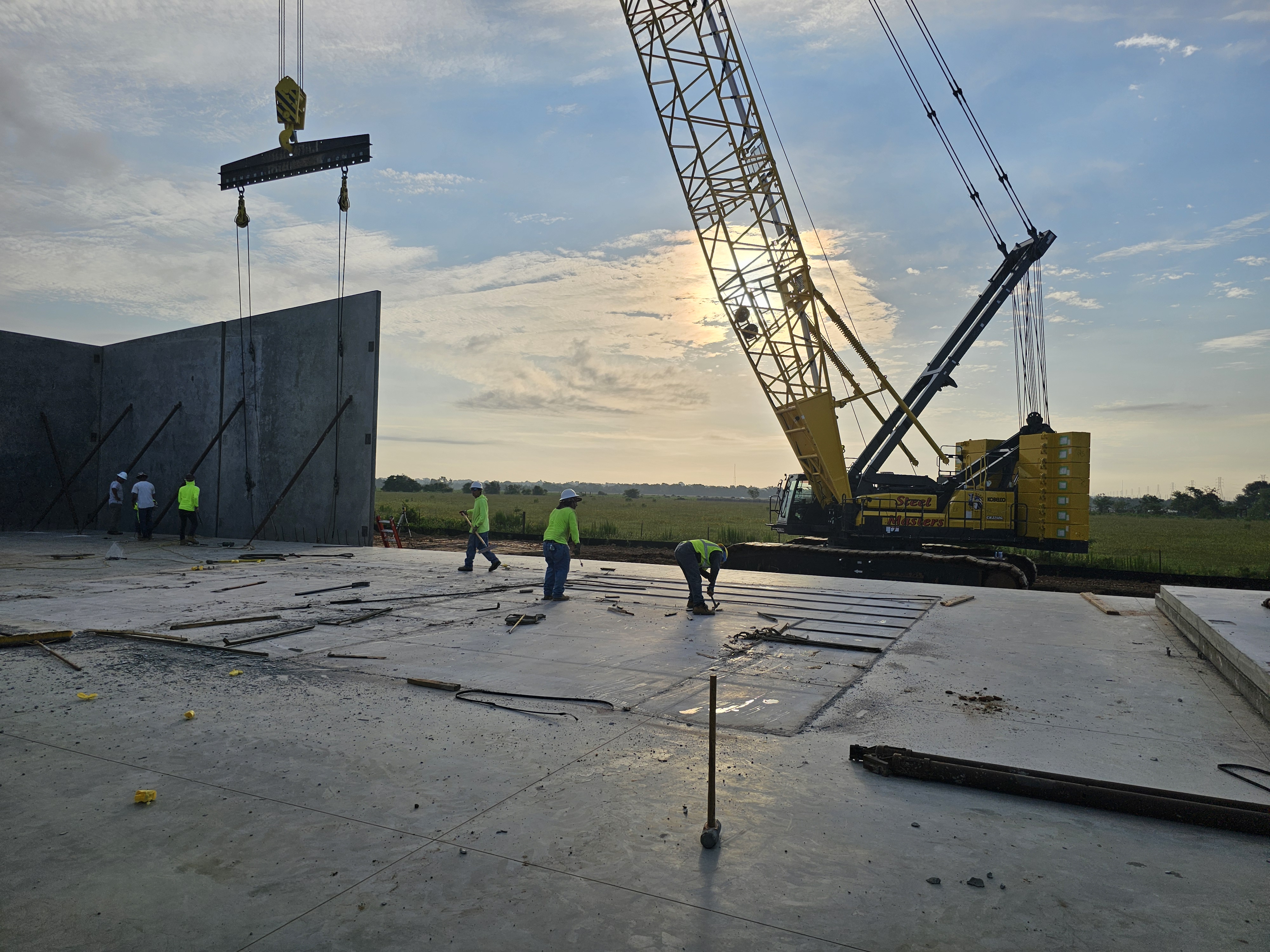 Longhorn Builders construction crew and crane on a commercial project